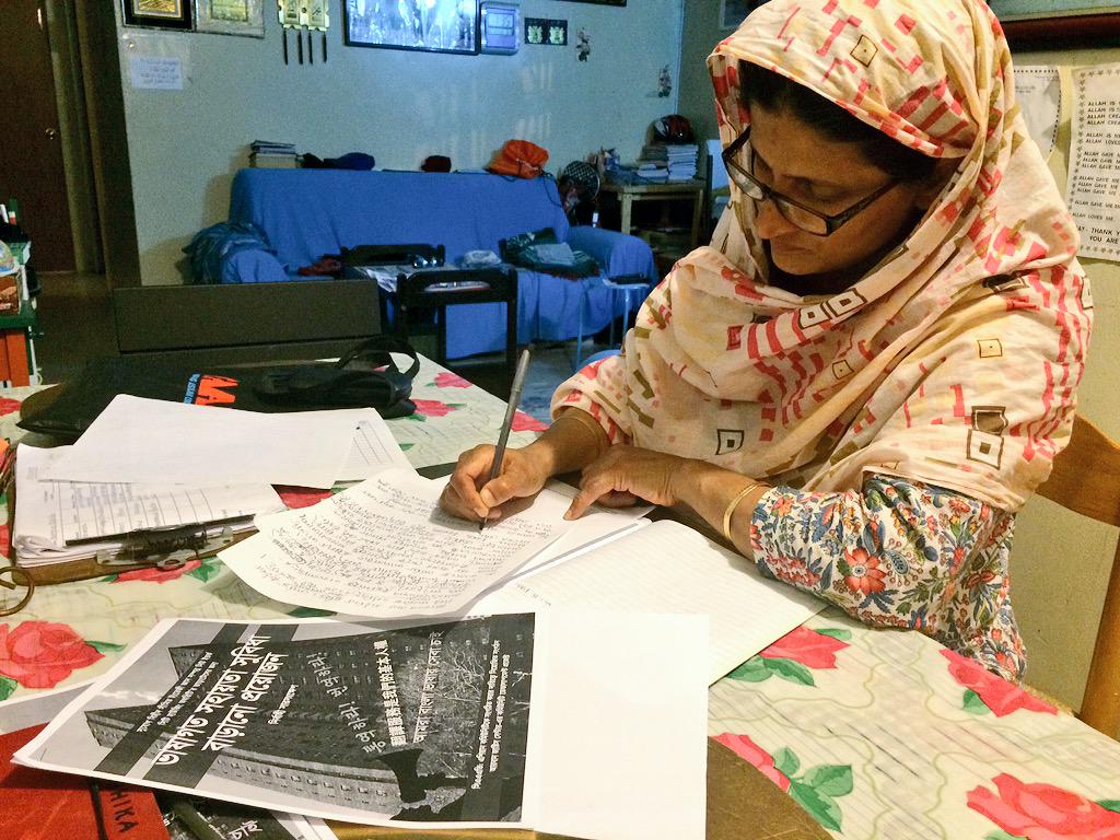 Bengali NYCHA leader Nayrin Apa preparing statements for a press conference.